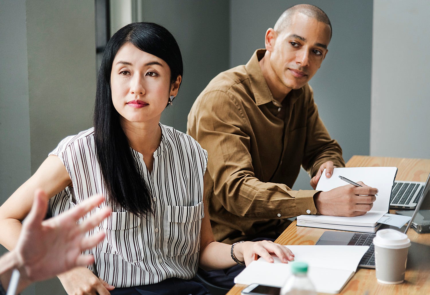 Man and woman listening attentively